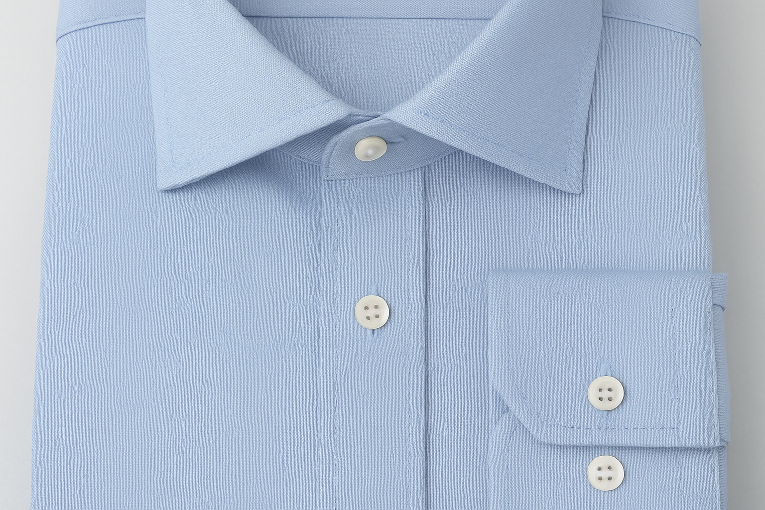 Light blue dress shirt fabric detail - superior stitching quality